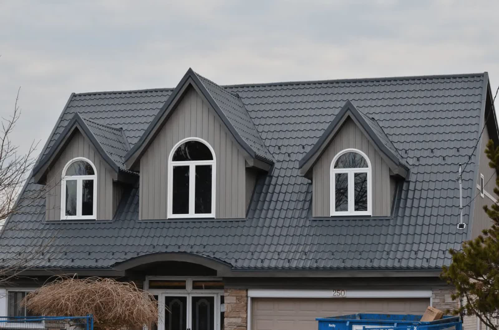 Grey home with matching steel roof