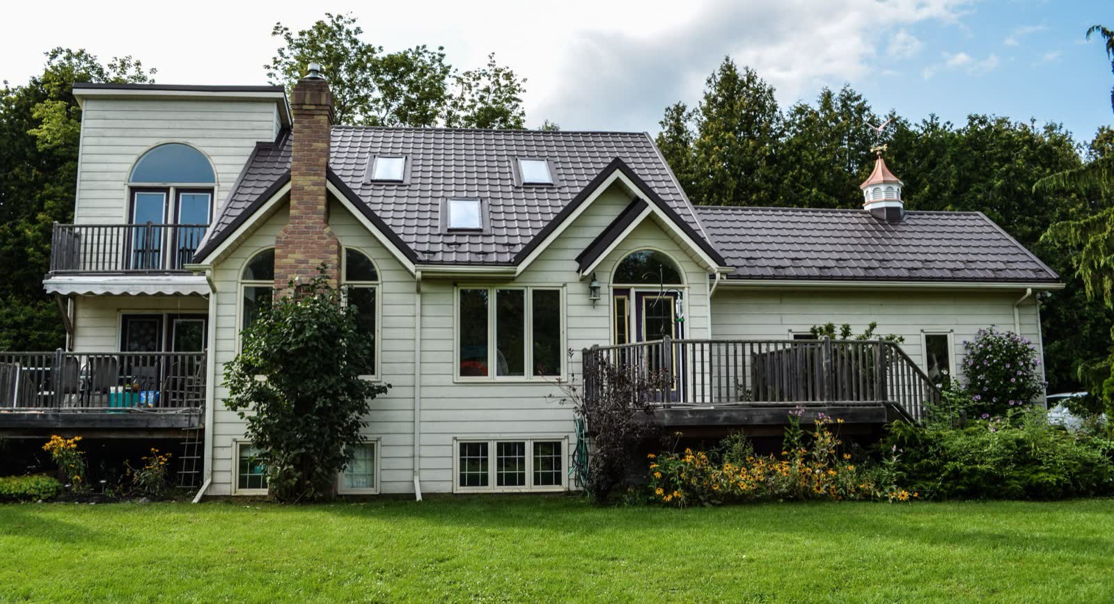 Lakeside home with a grey steel roof